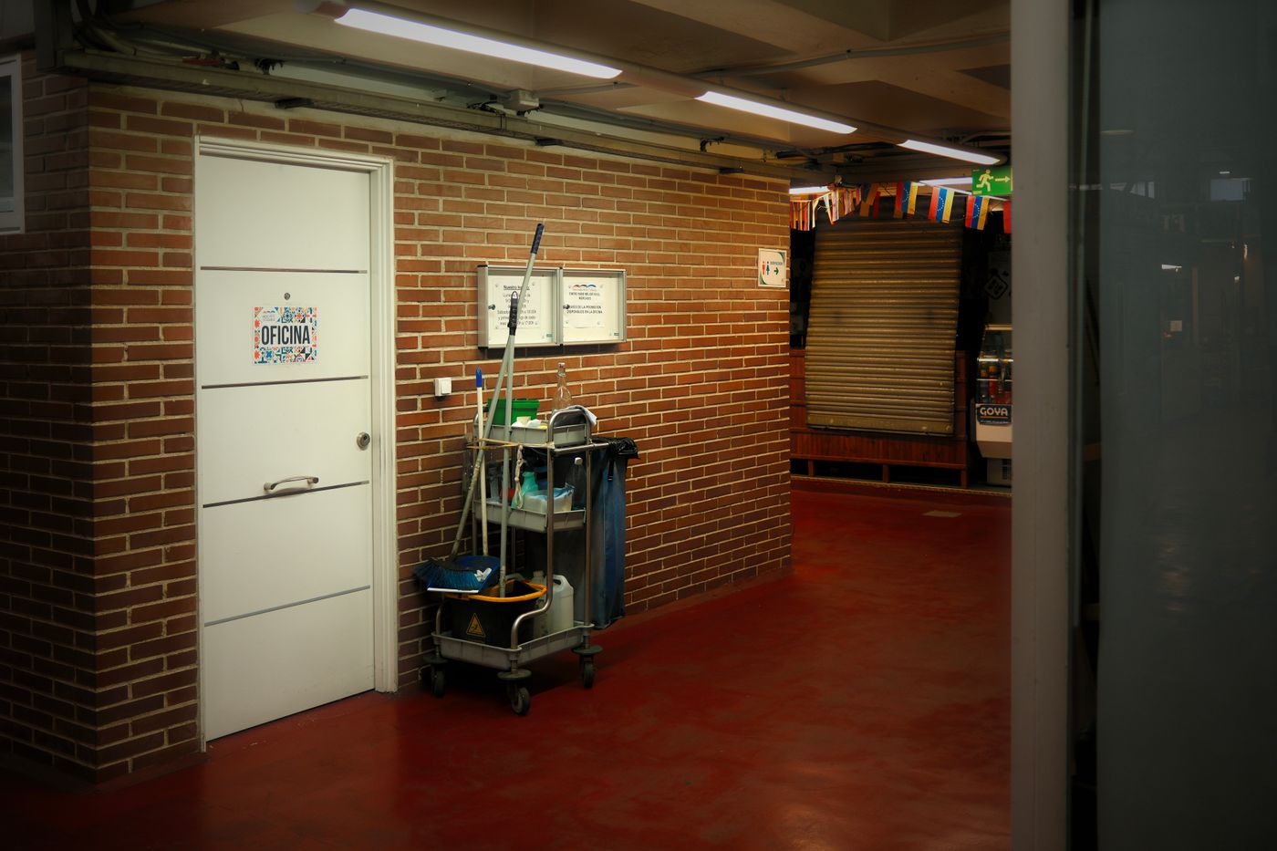 Cleaning cart staged in an office hallway during a nightly service visit